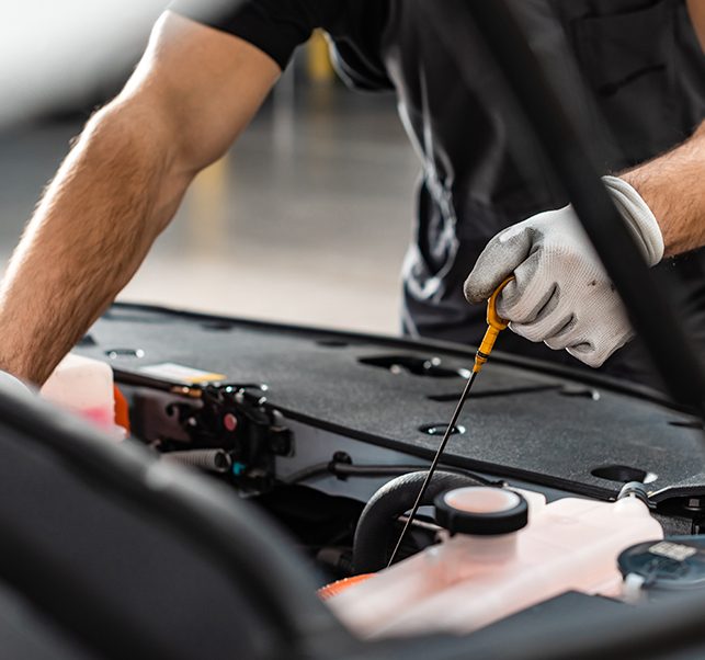 motor-trades-garage Mechanic working on a car